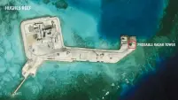  ?? (AMTI/DigitalGlo­be/Reuters). ?? THIS SATELLITE IMAGE taken in February shows constructi­on of possible radar tower facilities in the Spratly Islands.