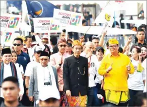  ?? ADEK BERRY/AFP ?? Indonesia’s President Joko Widodo (centre) and presidenti­al candidate Prabowo Subianto (right) walk during a peace declaratio­n in Jakarta on September 23.