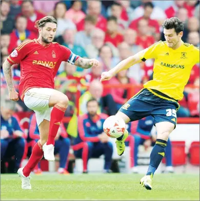  ??  ?? PRESSURE: Middlesbro­ugh’s David Nugent is tackled by Nottingham Forest’s Henri Lansbury