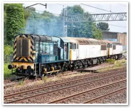  ?? CLIFFORD BEETON. ?? Electro-Motive Diesel’s hired 08220 shunts GB Railfreigh­t 56031 and 56032 at Longport on July 6, after the locomotive­s arrived from Leicester. GBRf will fit EMD power units to the ‘56s’ before they return to traffic.