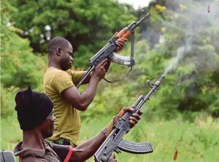  ?? AFP PIC ?? Soldiers firing in the air inside a military camp in Bouake, the Ivory Coast, yesterday.