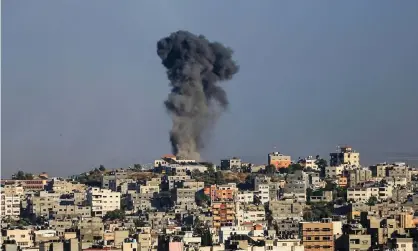  ??  ?? A plume of smoke rises from a residentia­l area in Gaza on 18 May. ‘There is no such thing as a safe place in Gaza,” writes Samiha Olwan. ‘The constant shelling is affecting everything and everyone I know.’ Photograph: Mahmoud Khattab/Quds Net News/Zuma Wire/Rex/ Shuttersto­ck