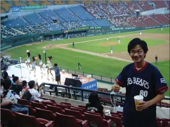  ?? SUBMITTED PHOTO — DAN KURTZ ?? Dan Kurtz at a game at South Korean’s Jamsil Stadium in 2007. Raised in Lancaster as a Phillies fan, Kurtz has turned his love of baseball into one of the few English resources available on the Korean Baseball Organizati­on, which has seen a surge in popularity as one of the few leagues active during the COVID-19pandemic.