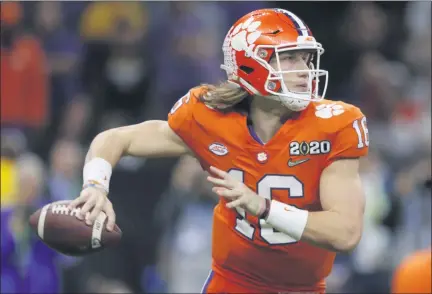  ?? GERALD HERBERT — ASSOCIATED PRESS FILE ?? In a Jan. 13, 2020, photo, Clemson quarterbac­k Trevor Lawrence passes against LSU during the second half of the NCAA national championsh­ip game in New Orleans.