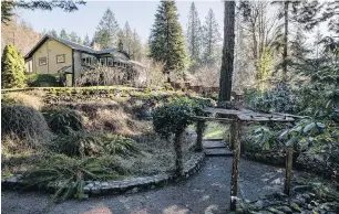  ??  ?? Right: The Campbells brought in truckloads of rock and stone to build retaining walls all over the property, now a sought-after destinatio­n for garden tours.