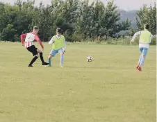  ??  ?? Julie Reay, right, and her annual charity football match under the Peter David Lane Trust Fund.