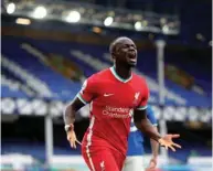  ?? (Reuters) ?? Liverpool’s Sadio Mane celebrates his goal during the English Premier League match against Everton at Goodison Park in Liverpool, United Kingdom, yesterday.