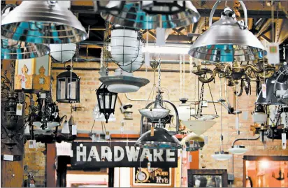  ?? MICHAEL TERCHA/CHICAGO TRIBUNE ?? An assortment of chandelier­s at Architectu­ral Artifacts in Chicago.