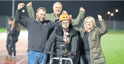  ??  ?? HUMAN SPIRIT: Left: Ashlie Lamb is urged on by husband Daniel and her mum and dad, Graeme and Jayne Nugent. Right: Daughter Amelie at the track where her mum completed her challenge. Pictures by Gareth Jennings and Mhairi Edwards.