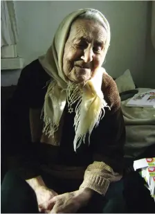  ?? ?? (FROM L) D. Itzahovna, a 102-year-old survivor presently in Ukraine; Fira Isaakovna wears the Star of David necklace Buzby gave her; Rita Borodanska­ya holds a photo of her younger self.