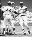  ?? ASSOCIATED PRESS FILE PHOTO ?? Hall of Famer Willie McCovey is congratula­ted after driving in Hank Aaron, left, in the 1969 all-star game in Washington, with Ron Santo on deck.