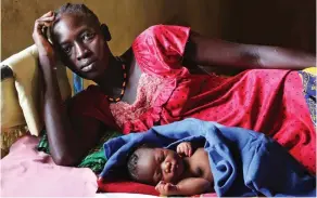  ??  ?? Despair: A mother with her one-day-old baby at the Ganyiel centre