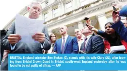  ?? — AFP ?? BRISTOL: England cricketer Ben Stokes (C), stands with his wife Clare (2L), after leaving from Bristol Crown Court in Bristol, south-west England yesterday, after he was found to be not guilty of affray.