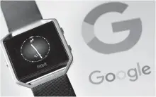 ?? Reuters-Yonhap ?? Fitbit Blaze watch is seen in front of a displayed Google logo in this 2019 illustrati­on.
