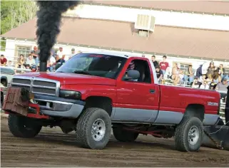  ??  ??  Running in the United Pullers Open Street class, Shannon Perkins took her first shot at sled pulling in this Cummins-powered Dodge she calls the Little Red Wagon. Unfortunat­ely, things didn’t go quite as planned as some axle hop and bounce led her to...