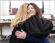  ?? ?? Newly sworn-in Berks County Commission­er Lucine E. Sihelnik is hugged by President Judge M. Theresa Johnson following the ceremony Tuesday, Feb. 21, in the Berks County Courthouse. Sihelnik former Commission­er Kevin S. Barnhardt, who had resigned to become the county’s chief operating officer.