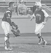  ?? Leslie Plaza Johnson ?? Garrett Whitley scores one of four runs for Dickinson in the first inning of Friday night’s Class 6A playoff game against Brazoswood.