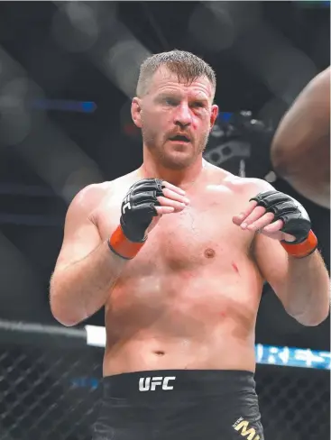  ?? Picture: GETTY IMAGES/AFP ?? TOUGH GOING: Stipe Miocic on his way to a gruelling win over Francis Ngannou.