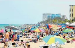  ?? TODD ROLLERCOUR­TESY ?? People attend the Great American Beach Party in Fort Lauderdale.