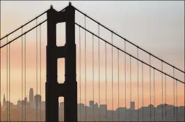  ?? MARCIO JOSE SANCHEZ / ASSOCIATED PRESS ?? Smoke from wildfires fills the morning air Friday in a view of San Francisco through the Golden Gate Bridge from the Marin Headlands.