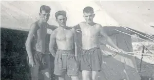  ??  ?? Colin Moir, right, outside his Christmas Island accommodat­ion with his tent mates