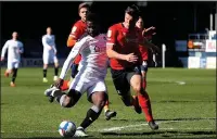  ??  ?? BIG HIT: Barnsley striker Dike scores against Luton