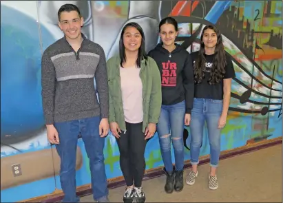  ?? Joseph B. Nadeau photo ?? Woonsocket High School senior Kyle Roberts, left, stands with fellow Urban Debate League team members, Hillary Thilavong, a junior, and Magda Wahby and Julie DeAlencar, both sophomores.