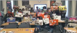  ?? SUBMITTED PHOTO ?? Lisa Ambers, founder and president of Beyond The Classroom, with parents and local children during the Vision Board Workshop at Waldorf West Library.