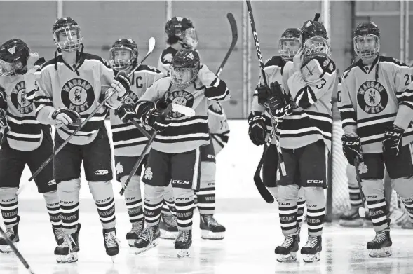  ??  ?? Wausau West players skate to their coach before the game against Superior High School at Marathon Park Ice Arena.