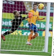  ??  ?? SAFE HANDS: Pickford denies Wood — one of a string of super saves made by the Everton keeper