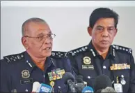  ?? ZHANG WENZONG / XINHUA ?? Noor Rashid Ibrahim, Malaysia’s deputy national police chief (left), speaks at a news conference in Kuala Lumpur on Sunday regarding the Kim Jong-nam case.