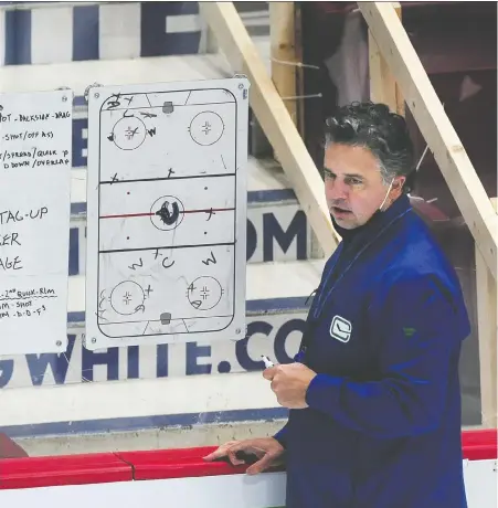  ?? NICK PROCAYLO ?? Canucks coach Travis Green uses a whiteboard during practice Sunday to draw attention to what he calls the team's sloppy systems play. Green wants the team to be hard to play against, as it was during last summer's playoffs. The Canucks face Ottawa tonight at Rogers Arena.