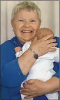  ??  ?? Symptoms: Doreen Trowsdale with one of her grandchild­ren