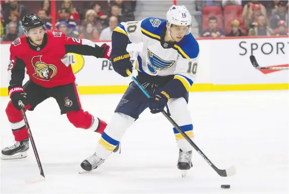  ?? MARC DESROSIERS/USA TODAY SPORTS ?? Blues centre Brayden Schenn keeps the puck away from the Senators’ Connor Brown Thursday, during a 6-4 Blues win at the Canadian Tire Centre.