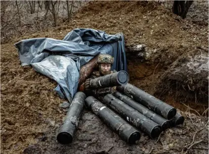  ?? FINBARR O’REILLY/NEW YORK TIMES/FILE ?? A Ukrainian soldier at a front-line position in Donetsk in December. With Russian troops on the attack and Western military aid in question, the country’s prospects are looking bleak.