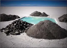  ?? (File Photo/AP/Dado Galdieri) ?? An evaporatio­n pond used to measure lithium and other mineral levels are seen July 26, 2010, in the Uyuni salt desert near Colchani, Bolivia.