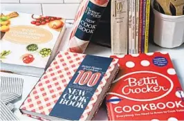  ?? ?? Multirecip­e cookbooks from well-known brands have often been handed down through the generation­s. Their content has changed to reflect the times and culture, but the premise of being an instructio­nal guide for new cooks remains.