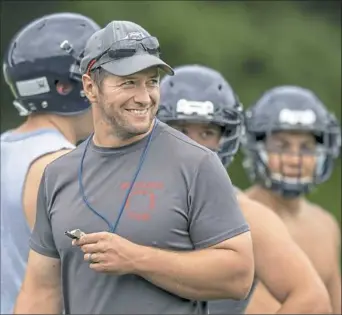  ?? Steph Chambers/Post-Gazette ?? Shaler second-year coach Jim Ryan has reason to smile — his Titans ended a 24-game losing streak in the first game of the season.