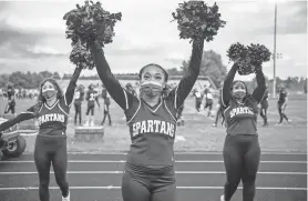  ??  ?? Lakeview (Mich.) cheerleade­rs Kayla Shupp, Alaya Marshall and Minate Lussier pump up the crowd Oct. 2. ALYSSA KEOWN/USA TODAY NETWORK