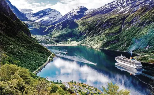  ??  ?? Water wonder: The spectacula­r Geirangerf­jord in Norway, where you can see soaring cliffs and wild, crashing waterfalls