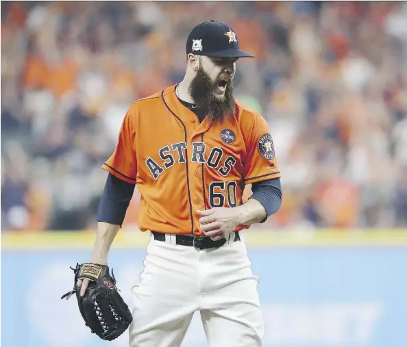  ?? ELSA/GETTY IMAGES ?? Starter Dallas Keuchel pitched seven innings of shutout ball Friday as the Astros topped New York 2-1 in Game 1 of the ALCS.