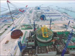  ?? JIANG KEHONG / XINHUA ?? Constructi­on of a third-generation reactor, using technology known as Hualong One, starts in Fuqing, East China’s Fujian province.