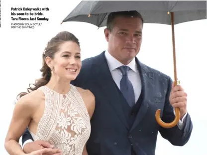  ?? PHOTOS BY COLIN BOYLE/ FOR THE SUN-TIMES ?? Patrick Daley walks with his soon-to-be-bride, Tara Flocco, last Sunday.