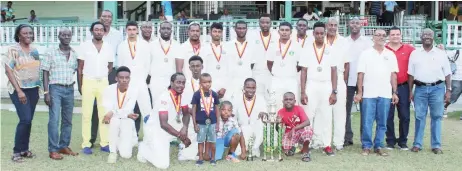  ??  ?? In victorious GNIC team surrounded by GCA and Noble House Seafoods officials at the conclusion of the second division final at GCC, Bourda, yesterday