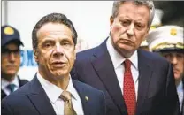  ?? KEVIN HAGEN AP ?? New York Gov. Andrew Cuomo (left) has been accused of sexual harassment by three women.