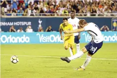  ??  ?? Harry Kane #10 of Tottenham Hotspur scores a penalty kick during the Internatio­nal Champions Cup 2017 match between Paris Saint-Germain and Tottenham Hotspur at Camping World Stadium on July 22, 2017 in Orlando, Florida. - AFP photo