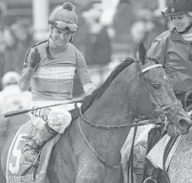  ?? Matt Slocum / Associated Press ?? Kent Desormeaux took Exaggerato­r around Pimlico Race Course in a shade less than two minutes for a 3½-length victory over Cherry Wine.