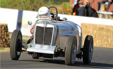  ?? Photo: Trapnell ?? GUNNING FOR IT: Cambooya’s Colin Schiller in his 1939 MG TB, which raced but did not finish at the original Leyburn Sprints in 1949.