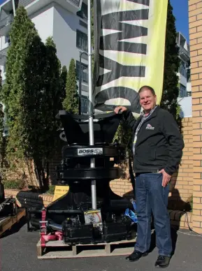  ??  ?? Boss Attachment­s’ Paul Herbison with a Dymax fixed felling head designed for thinning applicatio­ns in the forest.