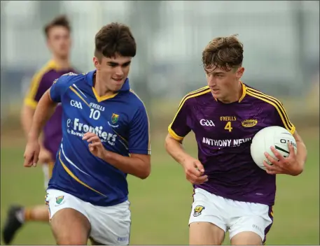  ??  ?? Wexford’s Jason Bolger is chased by Wicklow’s Eoin O’Neill.